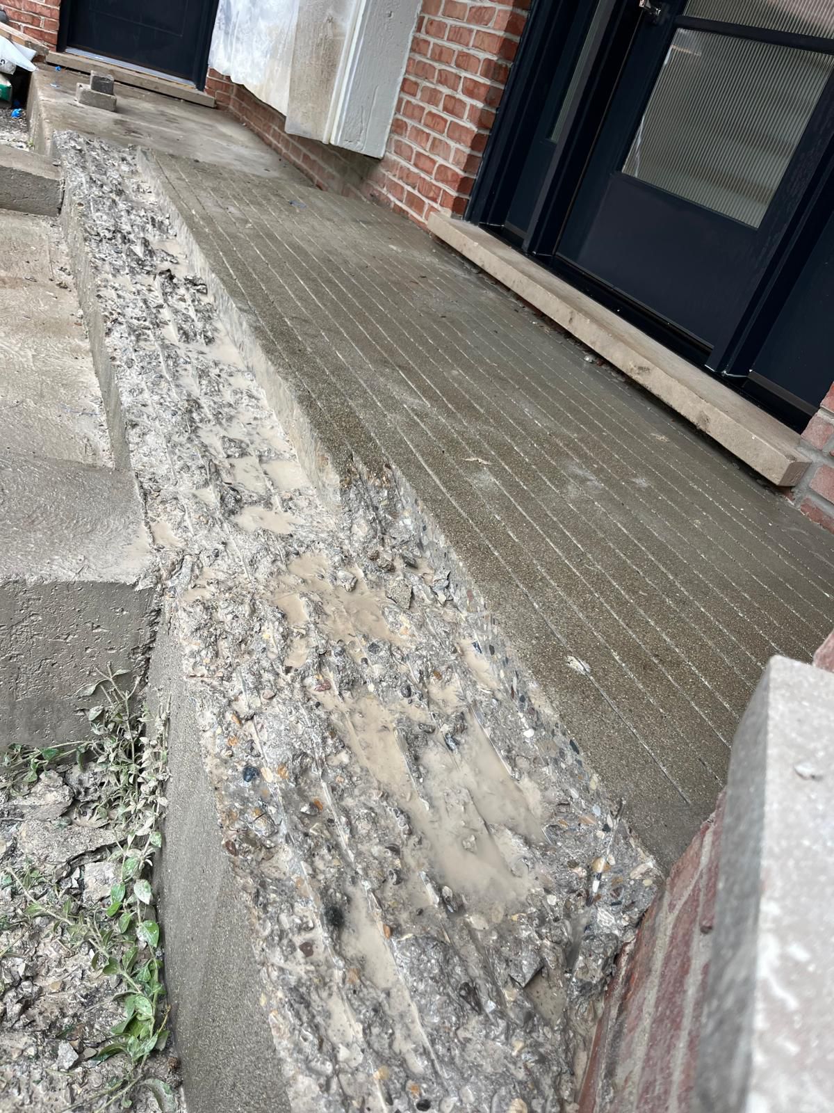 Brick and stone patio repair area