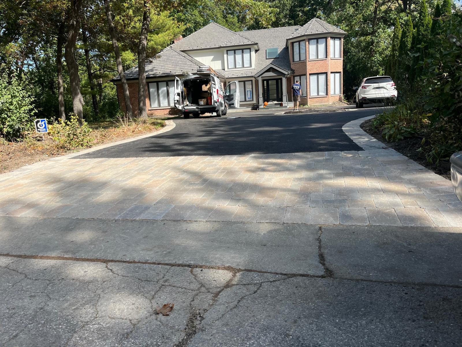 Finished asphalt driveway with stone edging