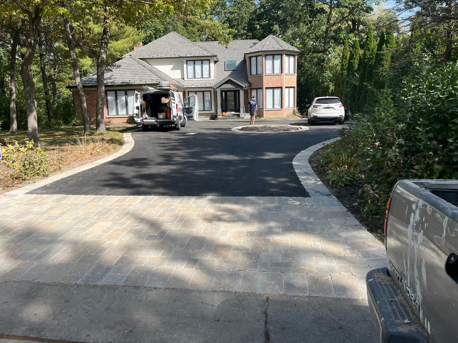 Finished paver apron with compactor