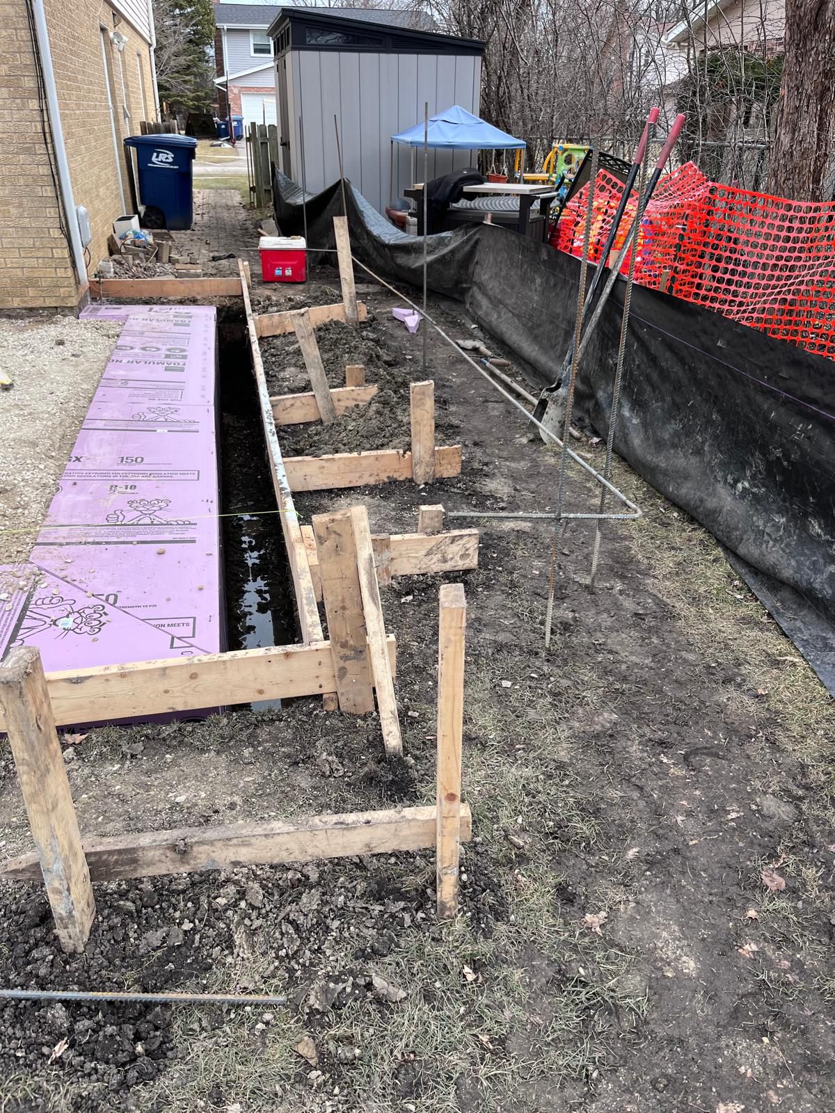 Sidewalk forms beside a home