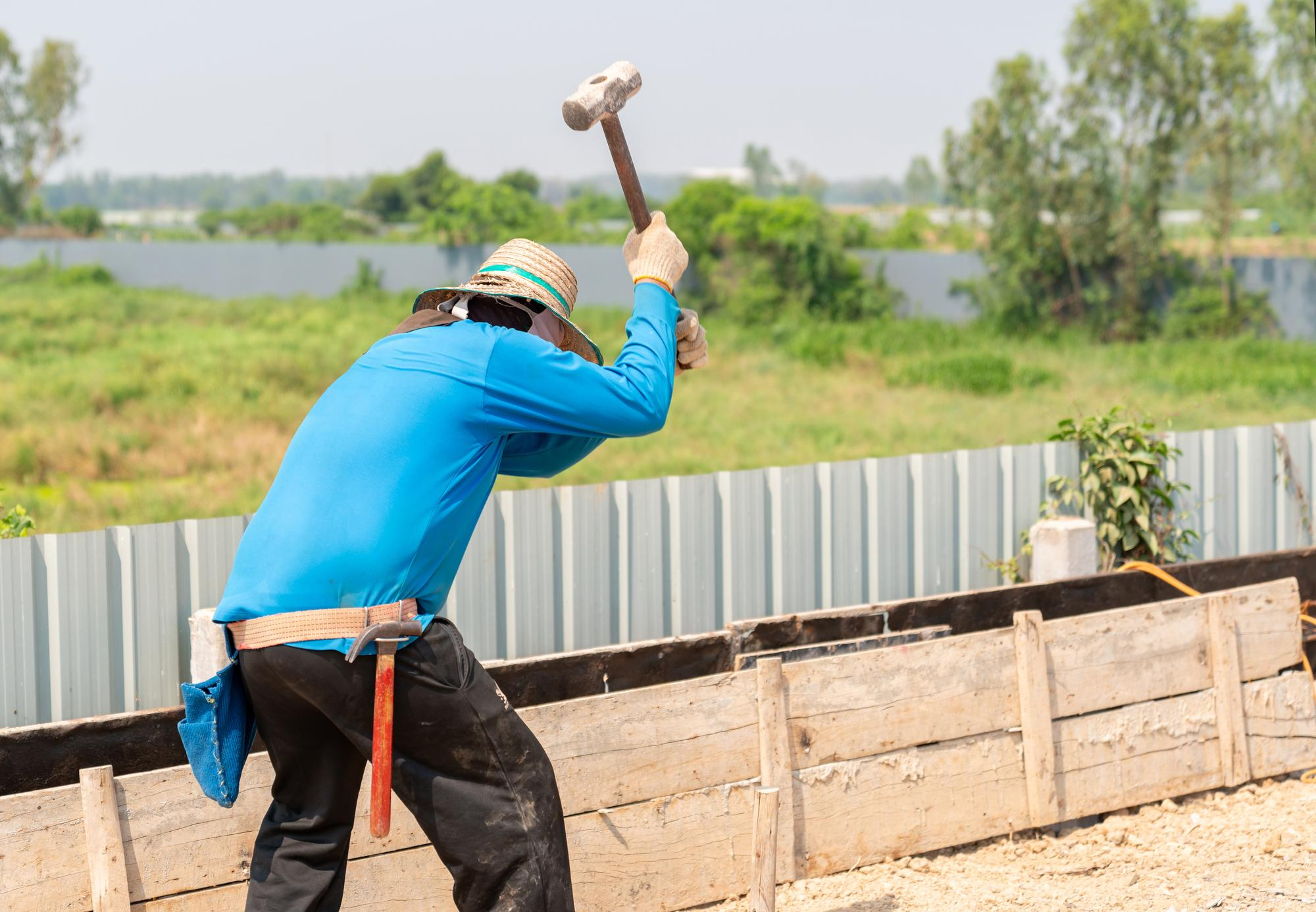 Construction worker building concrete forms